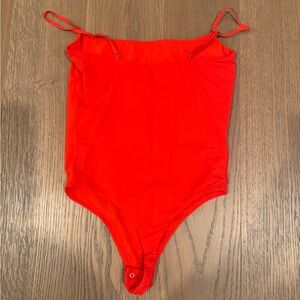Skims red bodysuit